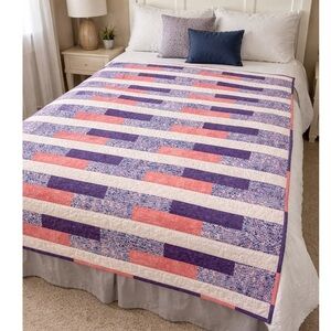 Homemade cotton quilt pink , purple and white with floral print backing